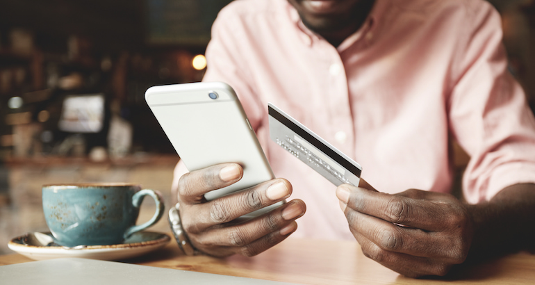 Person paying on their phone